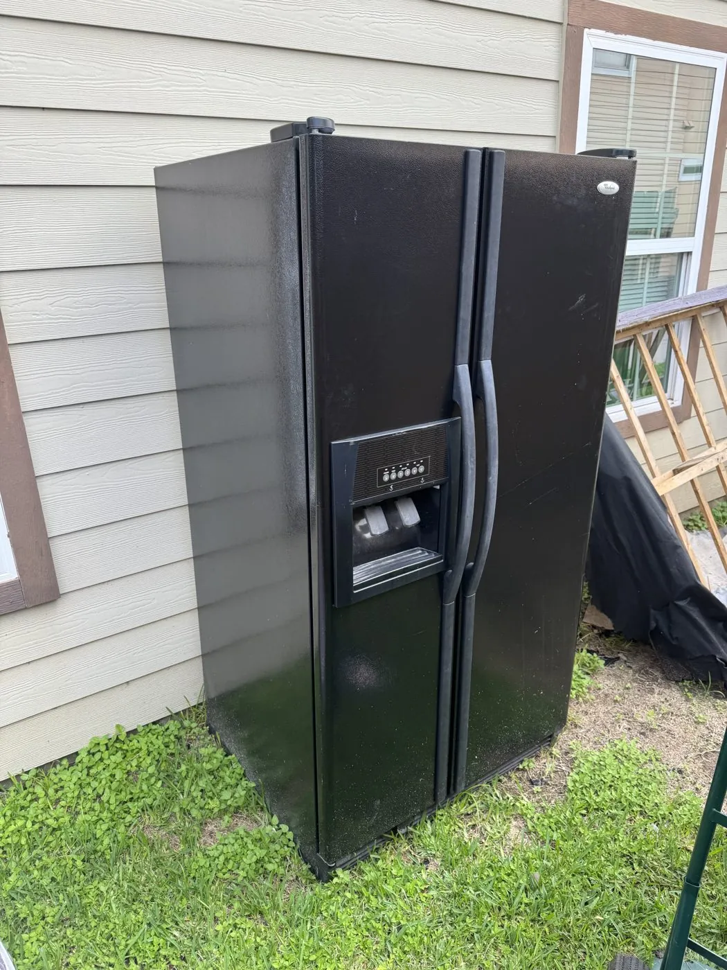 Old refrigerator hauled out of a College Station home by Aggie Haulers