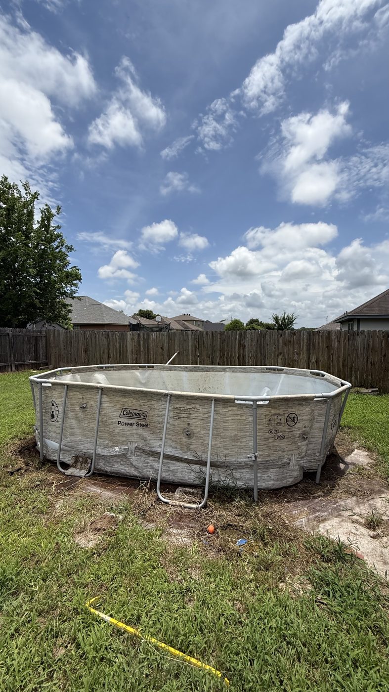 Above-ground pool before removal in a College Station backyard